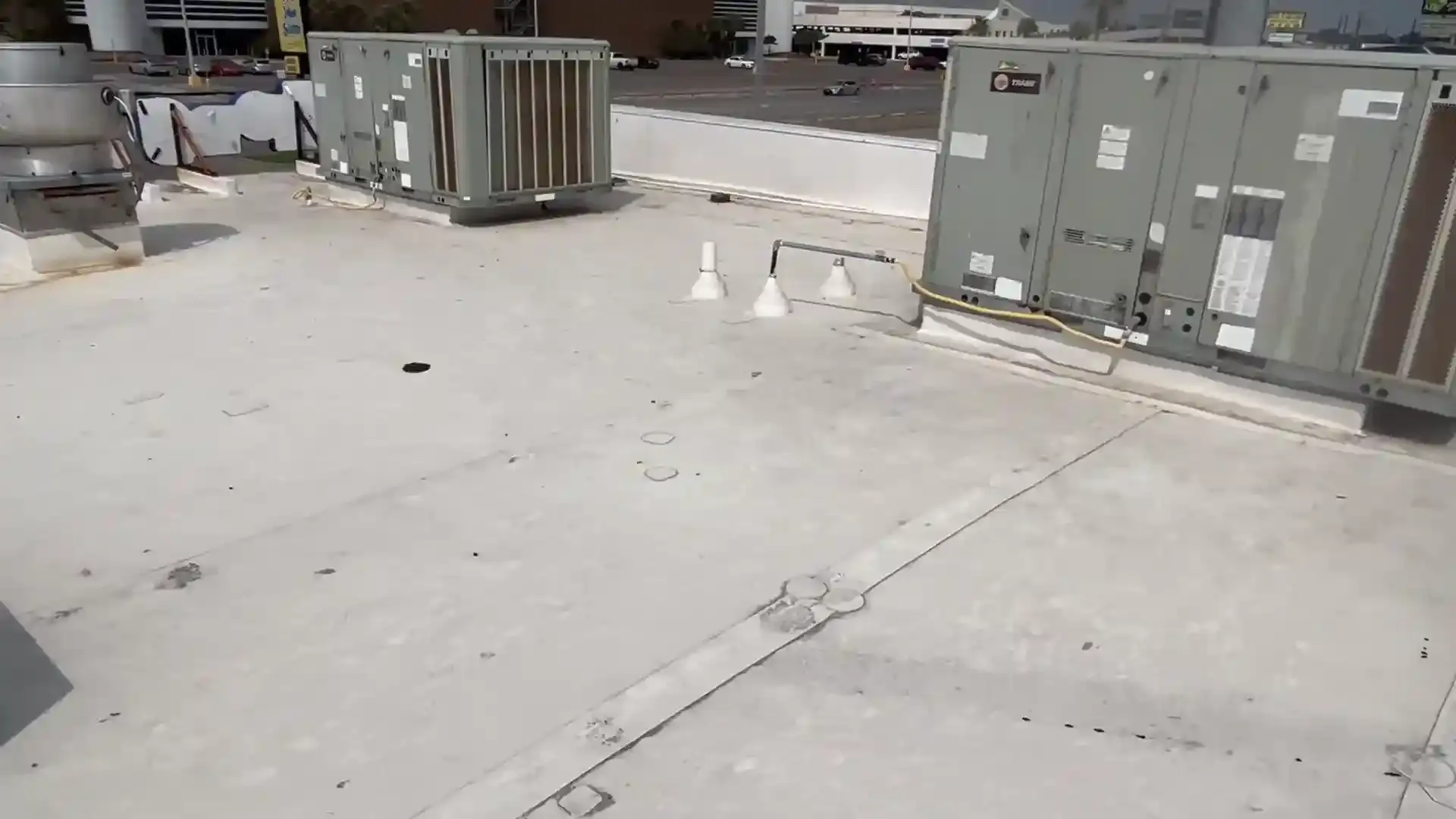 Commercial flat roof in Anaheim inspected for leaks and roof damage.